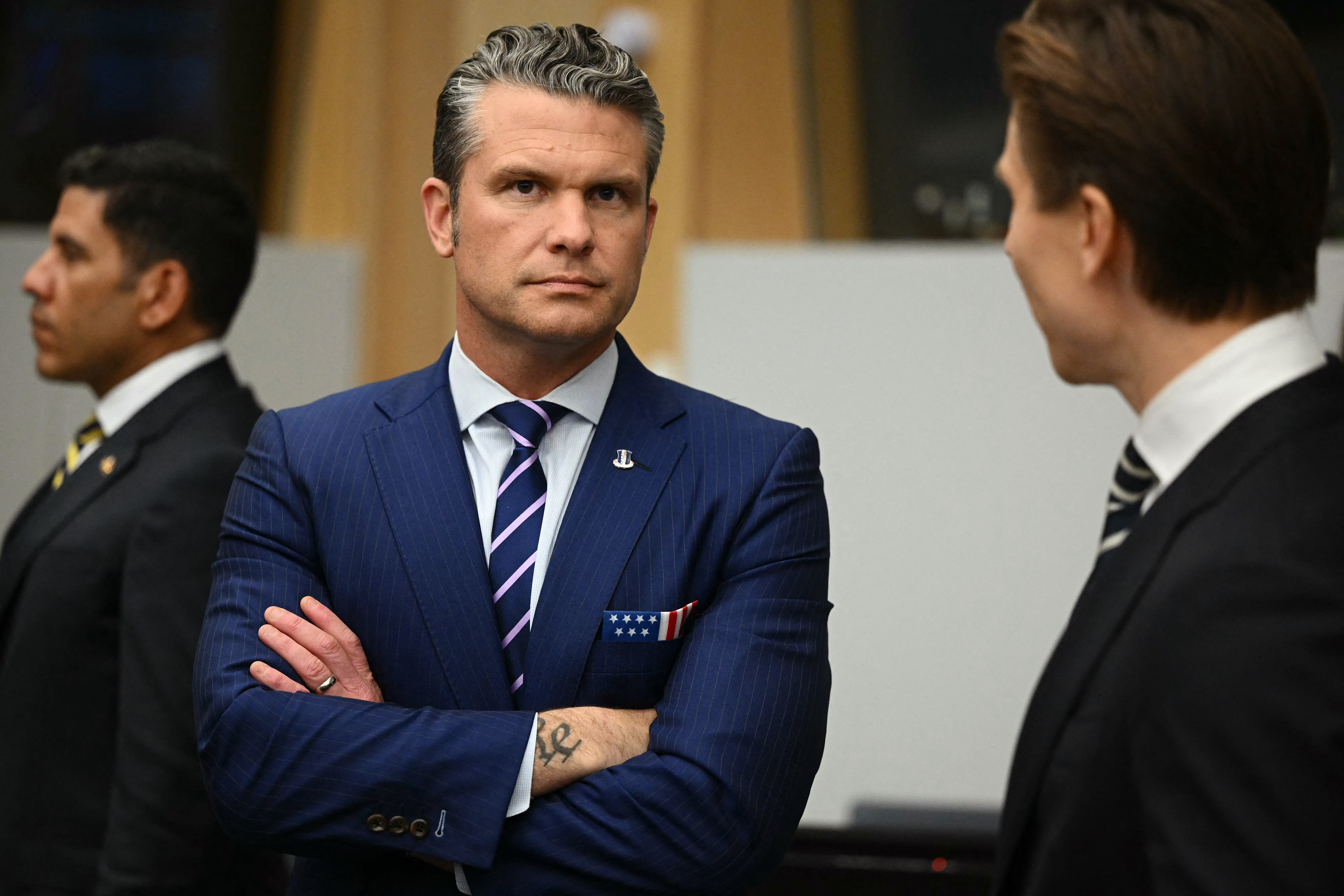 US Defense Secretary Pete Hegseth looks on ahead of the meeting of the Ukraine Defence Contact Group, part of the meeting of NATO Ministers of Defence Summit at the NATO headquarters in Brussels on October 15, 2025
