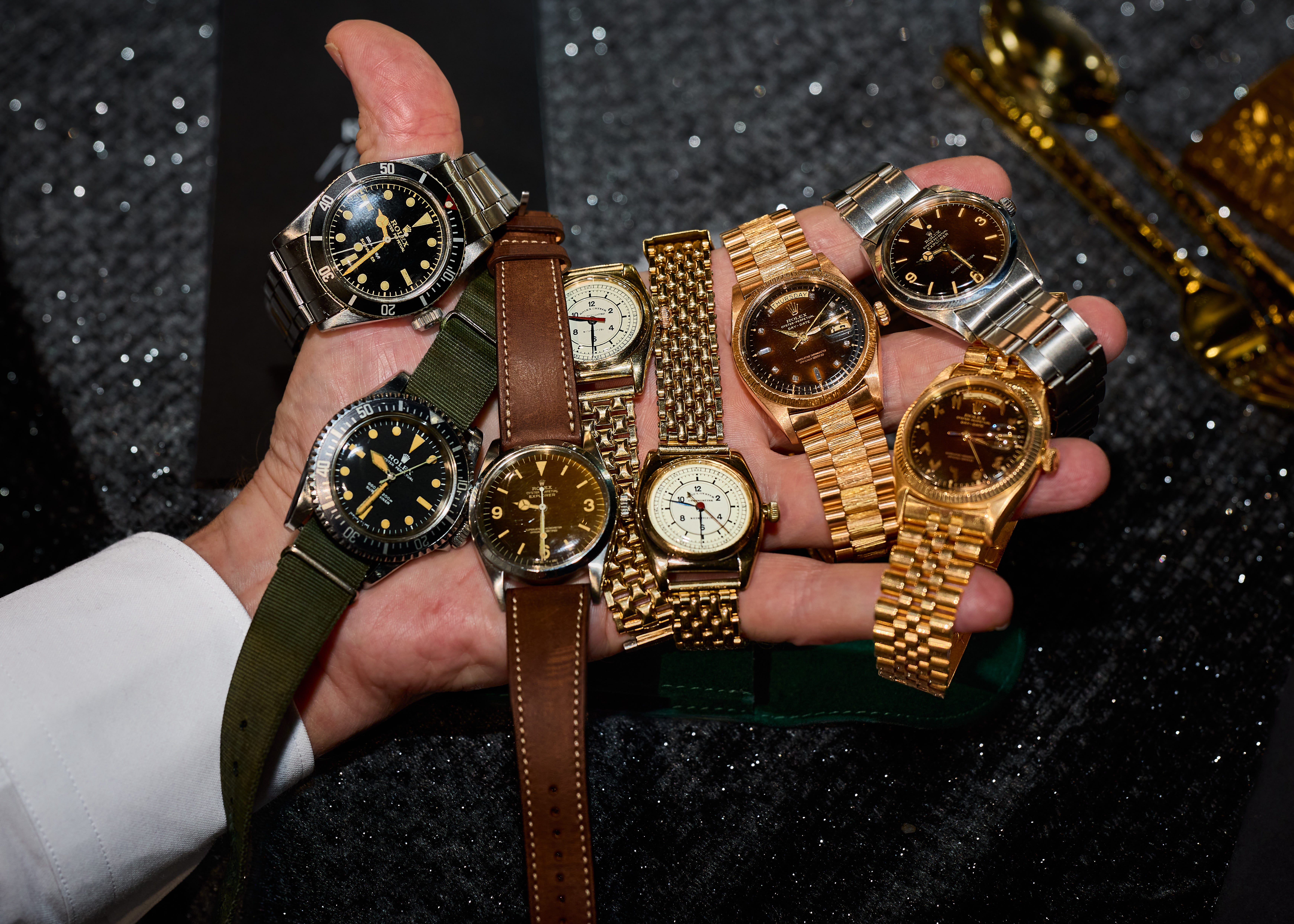 Hand holding watches