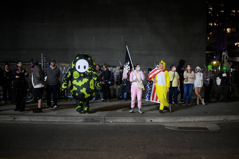 Protesters stand outside the U.S. Immigration and Customs Enforcement building on September 27, 2025 in Portland, Oregon