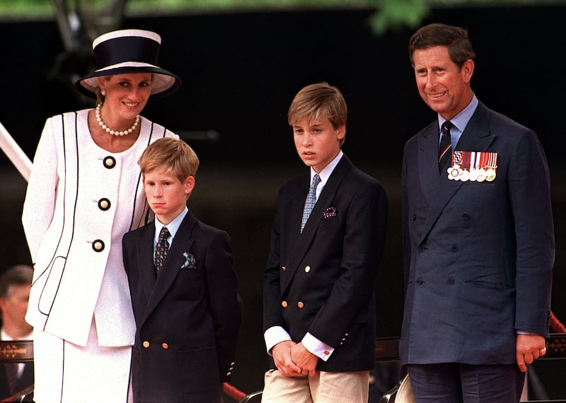 Princess Diana (1961 - 1997), Prince Harry, Prince William and Prince Charles at a parade in the Mall, London, during V.J. Day commemorations, August 1994. Diana is wearing a Tomasz Starzewski suit and a hat by Philip Somerville.