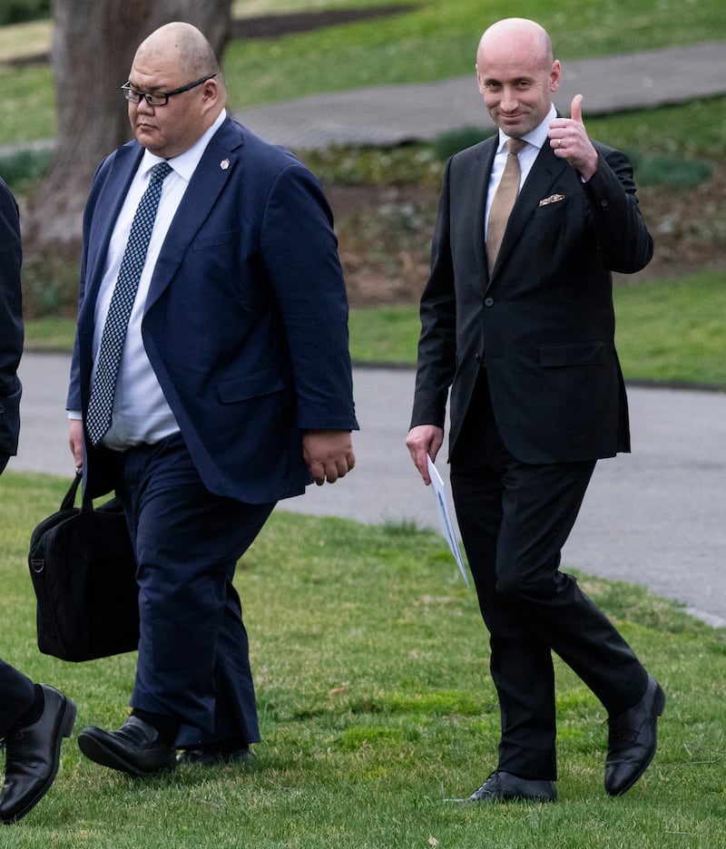 Elon Musk chats with US Secretary of Commerce Howard Lutnick as they walk with White House Communications Director Steven Cheung and White House deputy chief of staff for policy and US homeland security advisor Stephen Miller