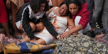 Rio favelas left reeling after lethal gang raid as families bury the dead