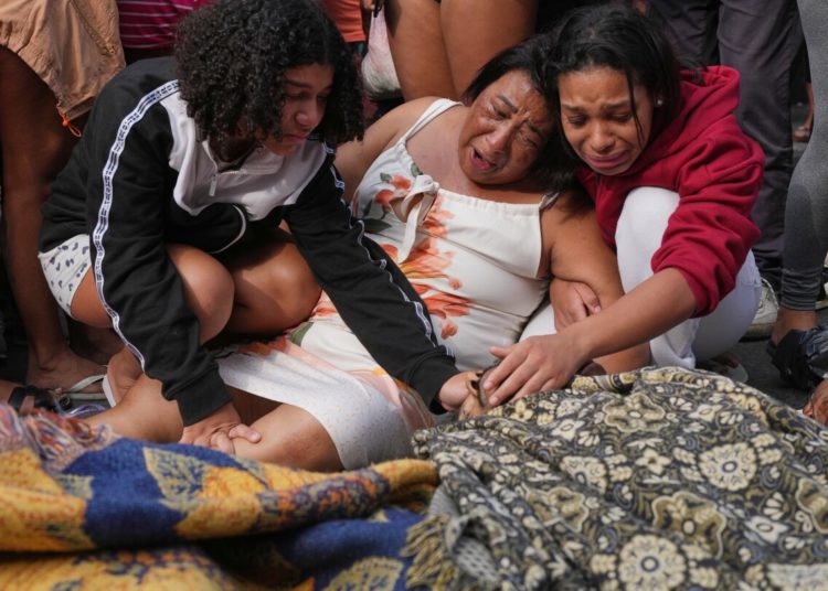 Rio favelas left reeling after lethal gang raid as families bury the dead
