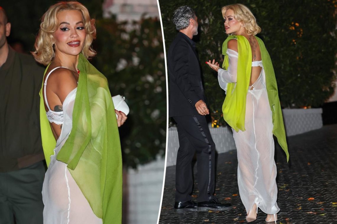 Rita Ora lets her lace lingerie play peekaboo in sheer white dress