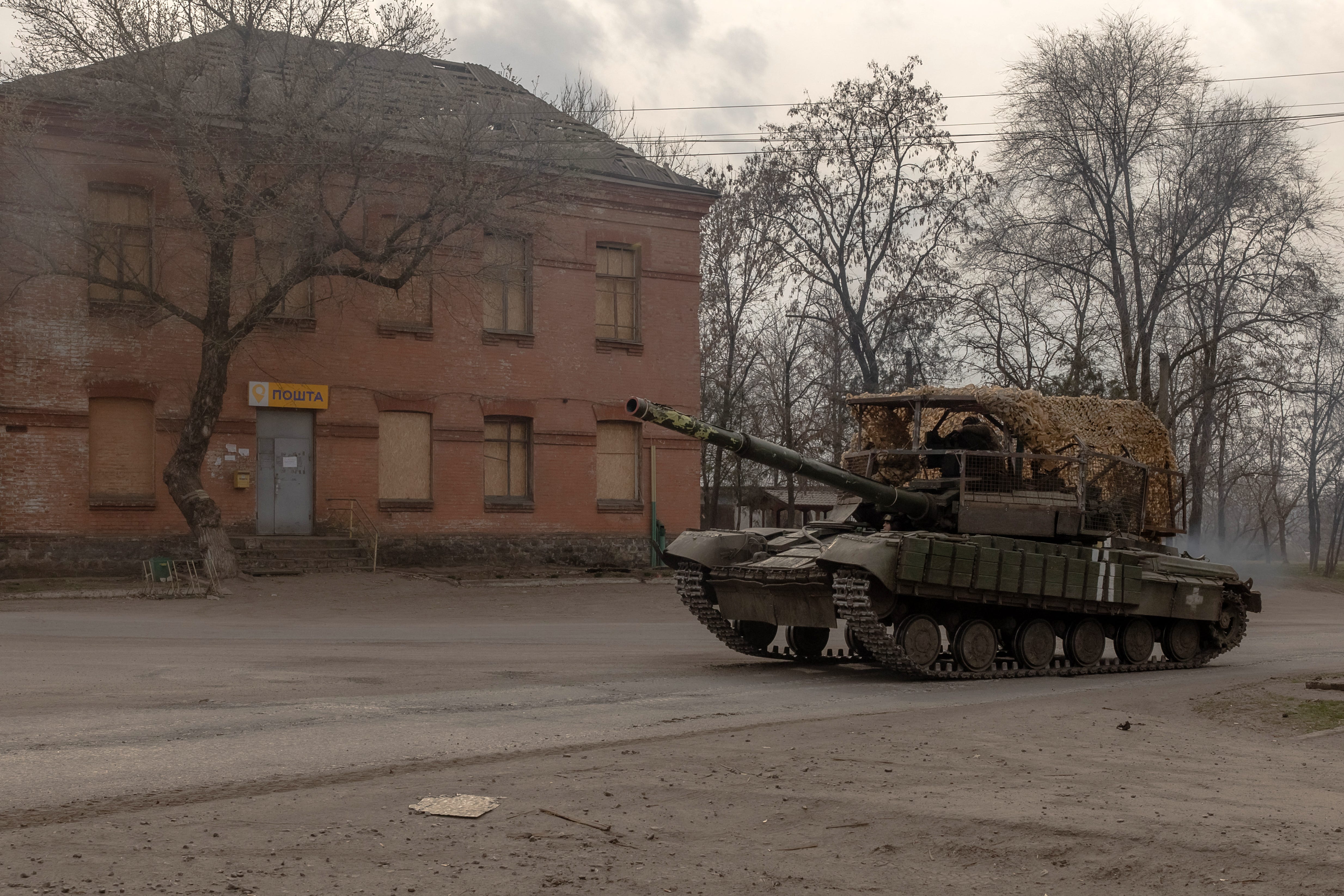 A Ukrainian tank drives on a road in a village in the Dnipropetrovsk region, on March 16, 2025.
