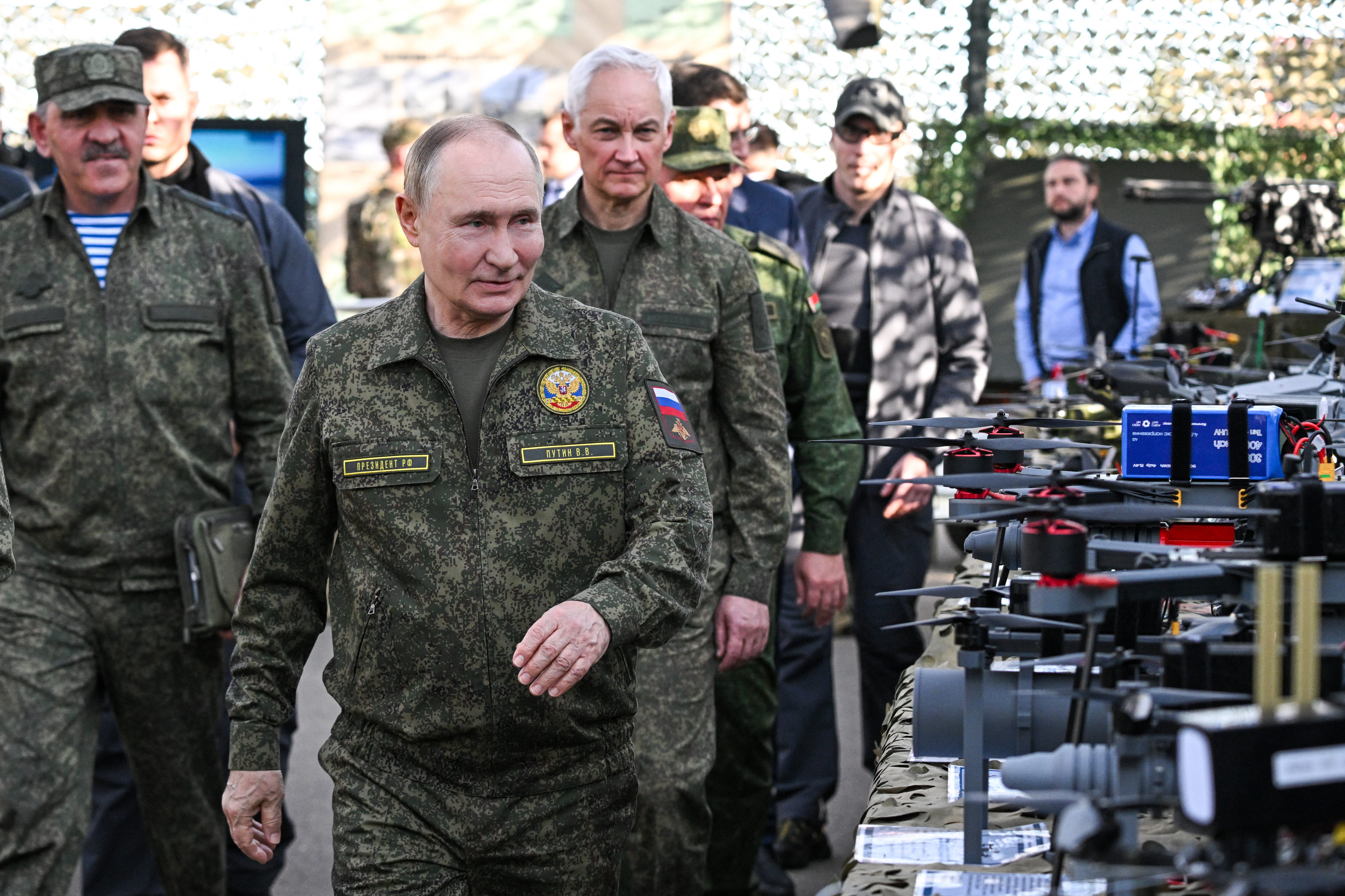 Russia's President Vladimir Putin tours an exhibition of military equipment.