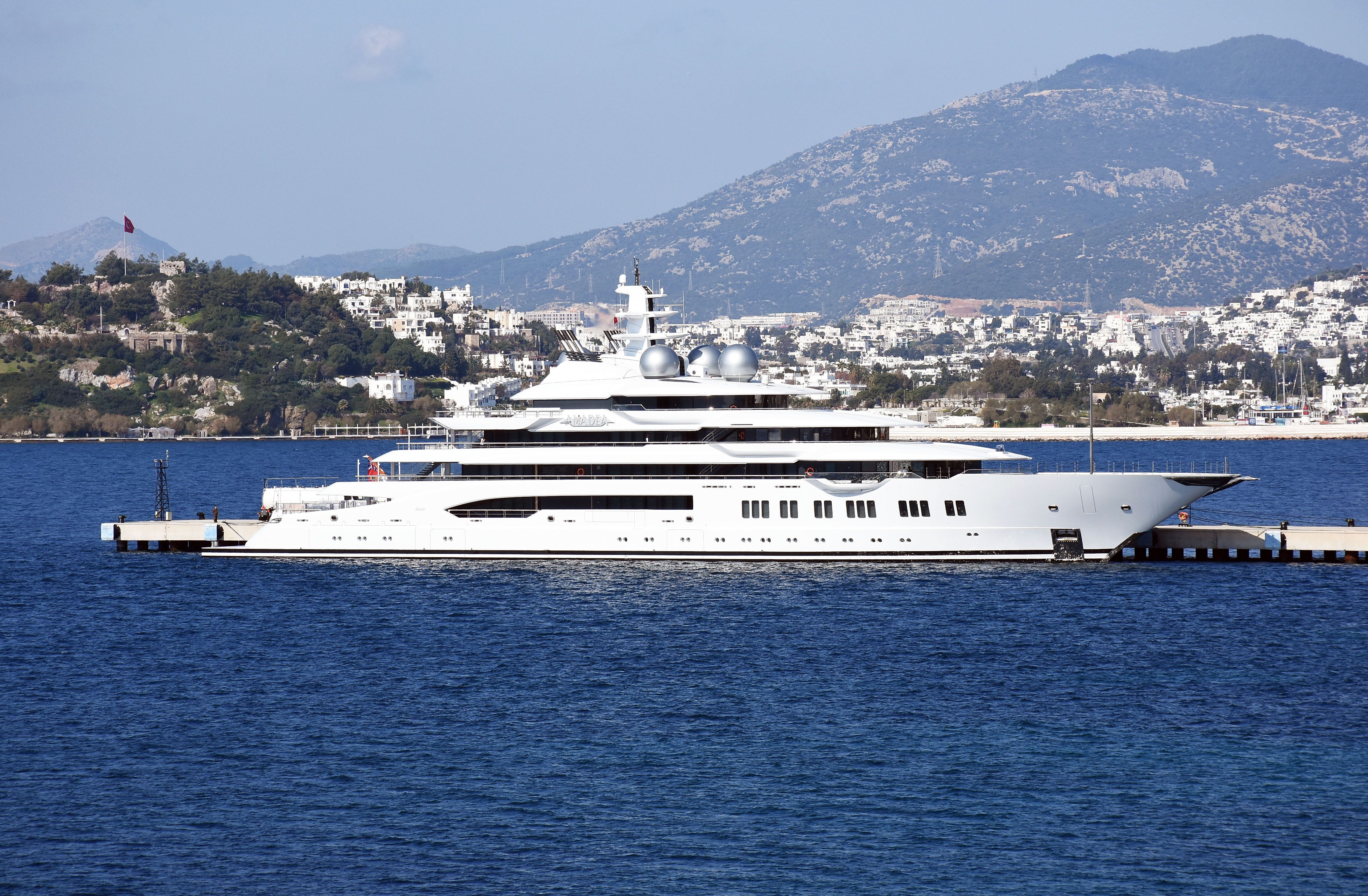 The 106m-long and 18m-high super luxury motor yacht Amadea, one of the largest yacht in the world is seen after anchored at pier in Pasatarlasi for bunkering with 9 fuel trucks, on February 18, 2020 in Bodrum district of Mugla province in Turkey