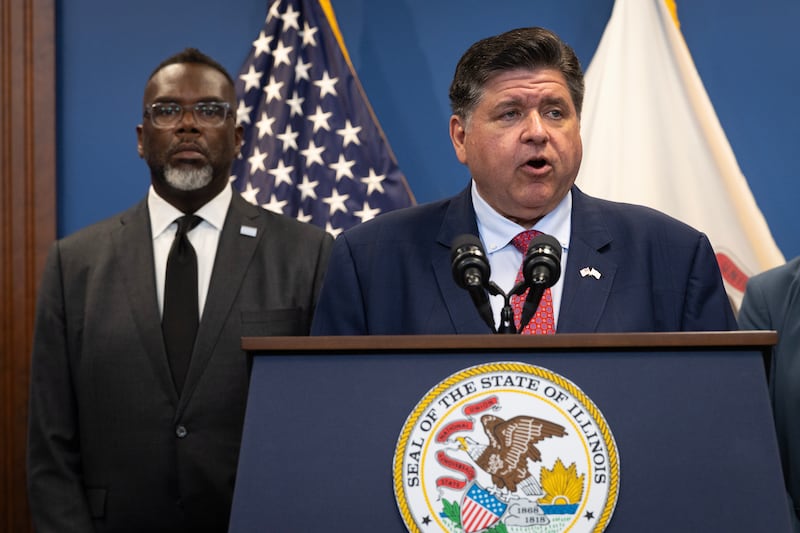 Illinois Governor JB Pritzker speaks to the press as Chicago Mayor Brandon Johnson listens on September 02, 2025 in Chicago, Illinois.