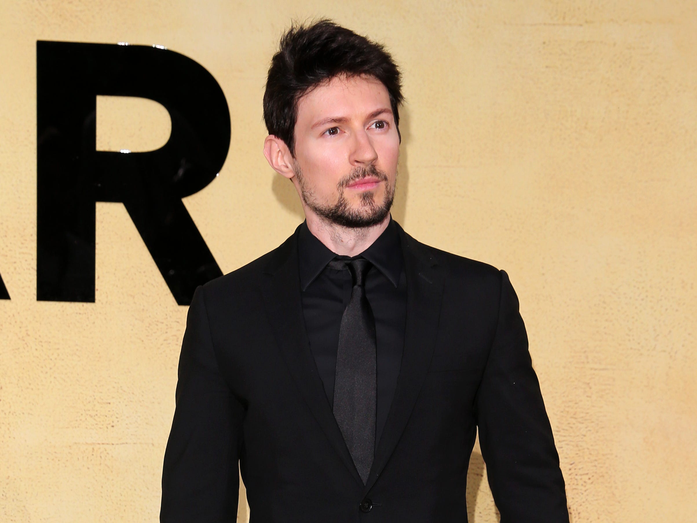 Telegram CEO Pavel Durov is wearing a black suit.