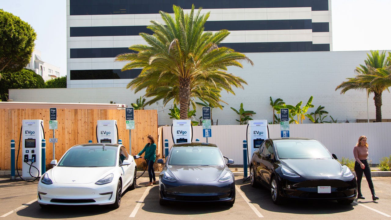 Three Teslas are pictured.