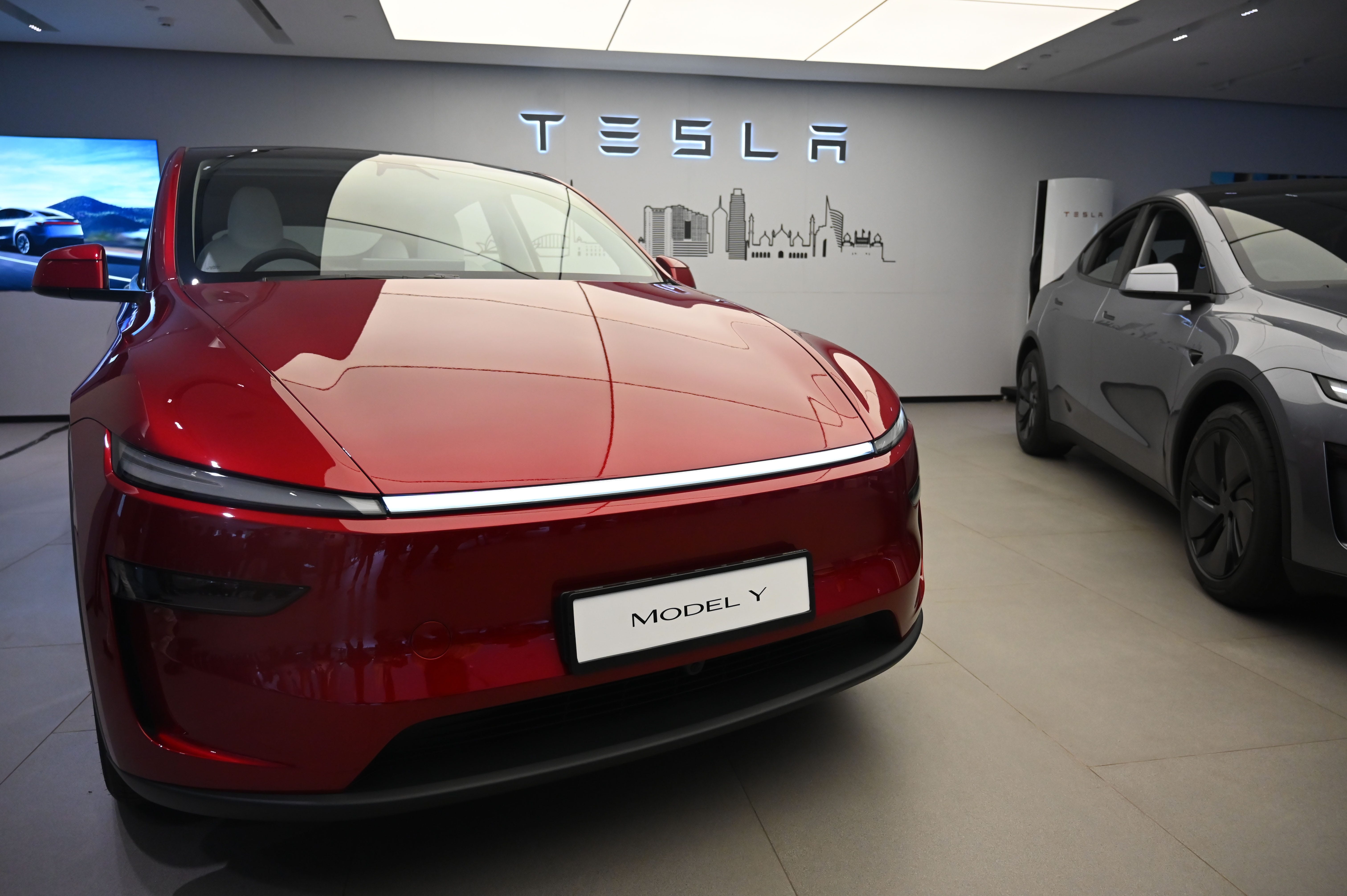 A red Tesla Model Y on display in a showroom in New Delhi, India.
