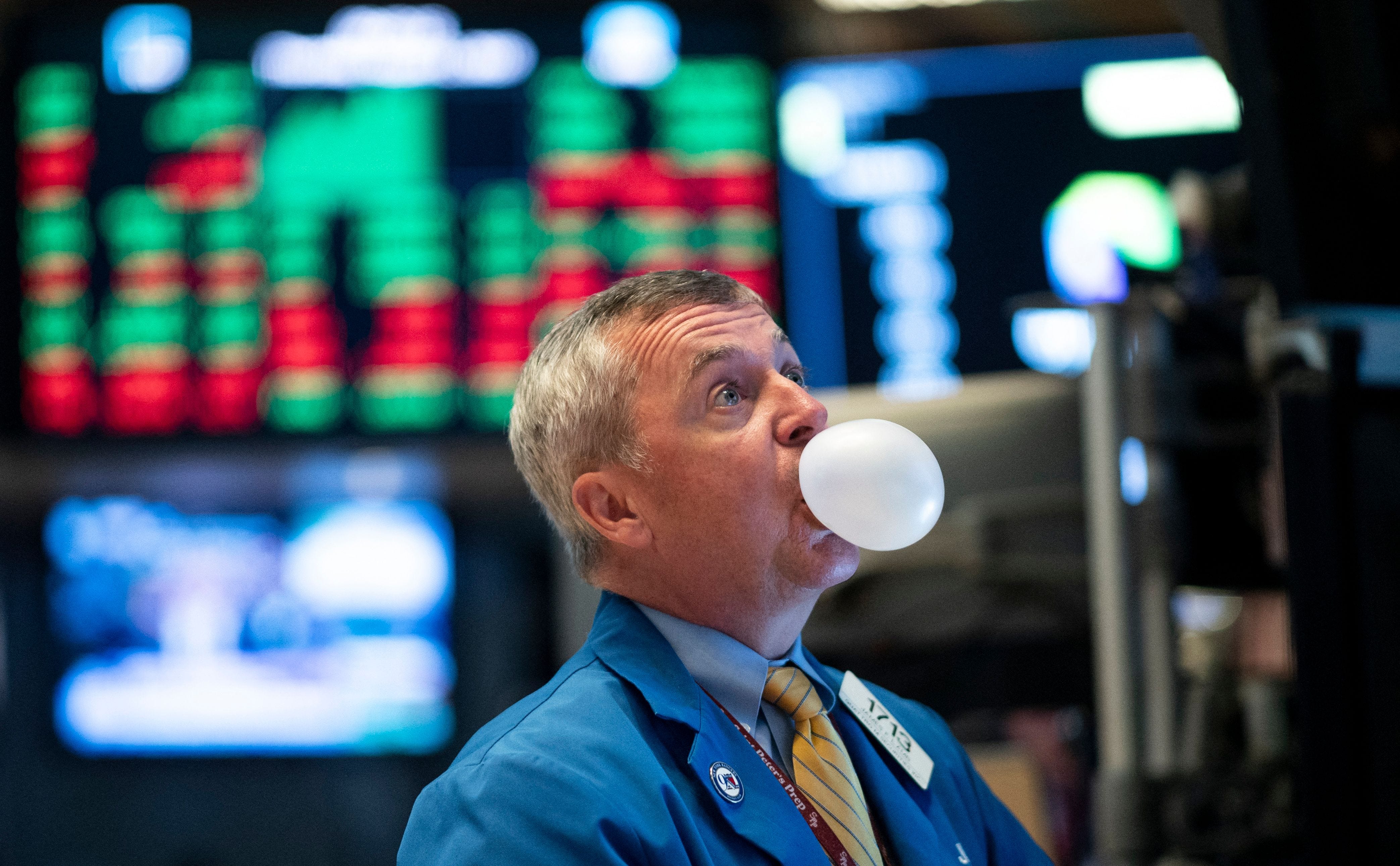 NYSE trader blowing a bubble with bubble gum