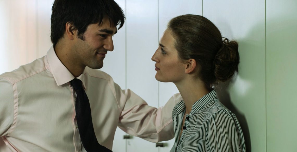 The Do’s and Don’ts of Flirting at Work Without Getting Fired, According to an Expert