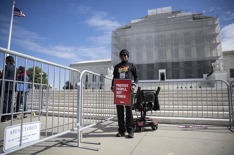 WASHINGTON DC, UNITED STATES - OCTOBER 15: Demonstrators hold signs in support of minority voting rights outside the U.S. Supreme Court in Washington, D.C., United States on October 15, 2025. The justices are hearing a major redistricting case that could impact the future of the federal Voting Rights Act and potentially pave the way for Republicans to gain additional congressional seats. (Photo by Celal Gunes/Anadolu via Getty Images)