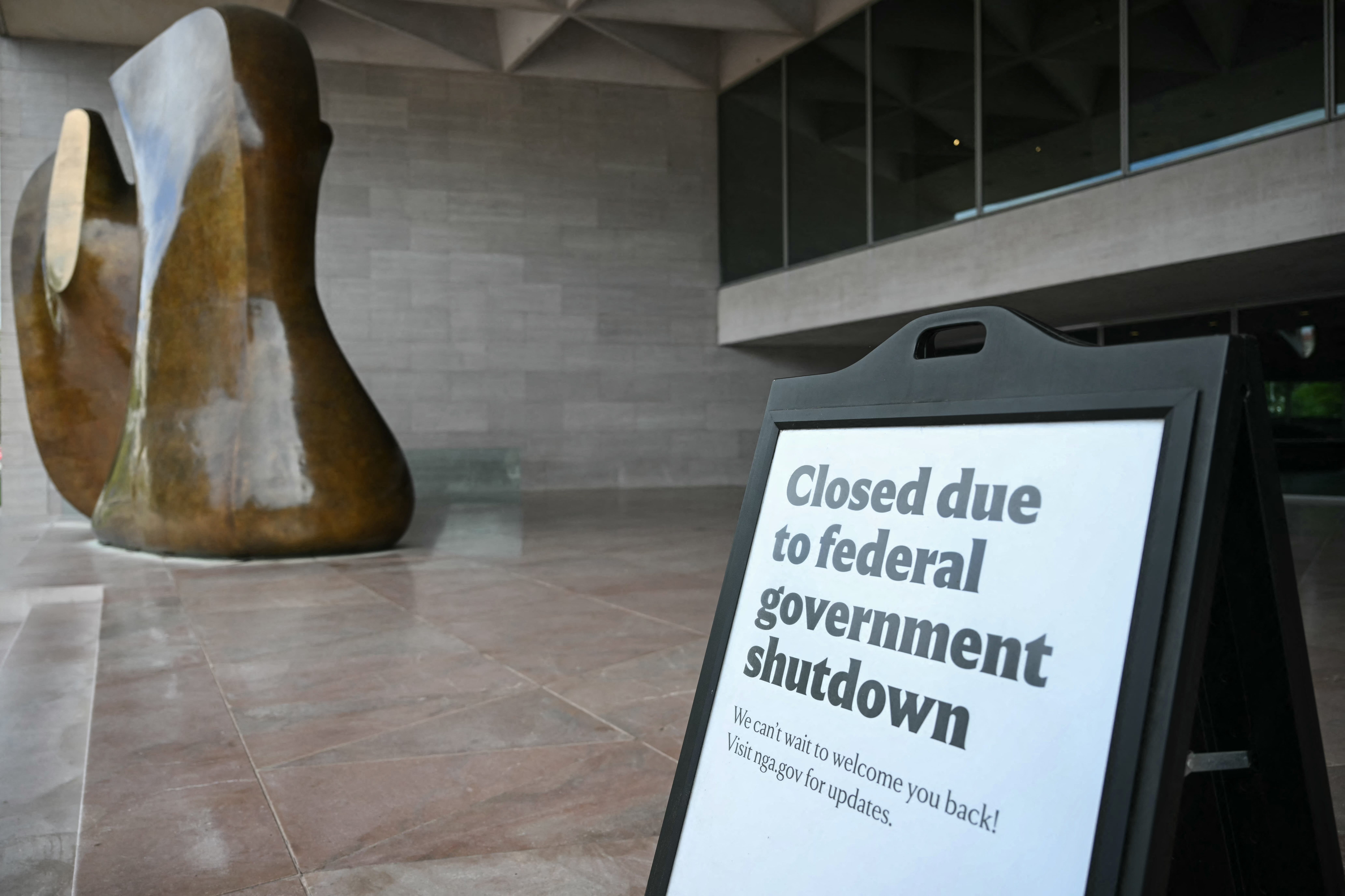 a sign that says closed due to federal government shutdown