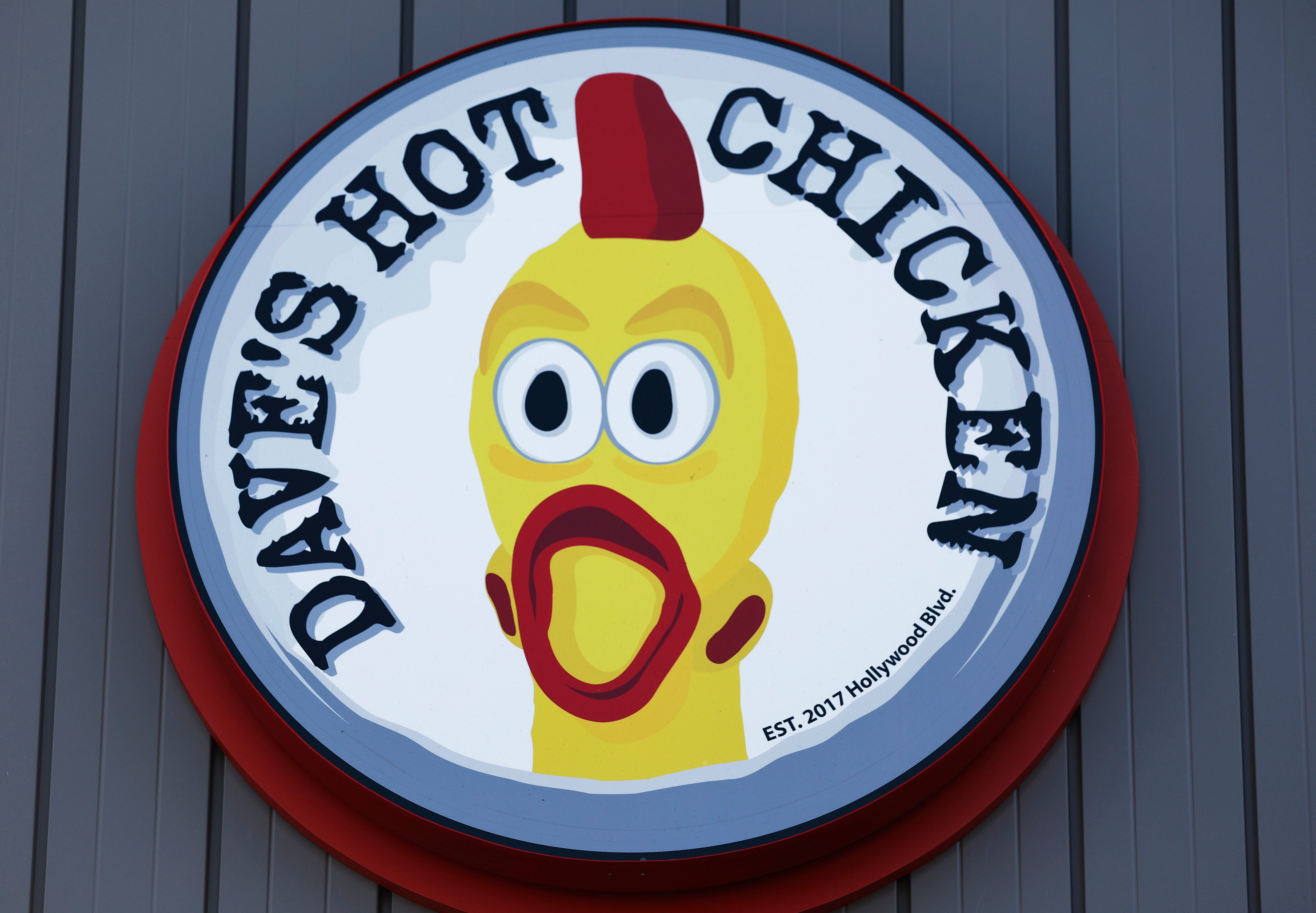 A Dave's Hot Chicken logo at a Dave's Hot Chicken store