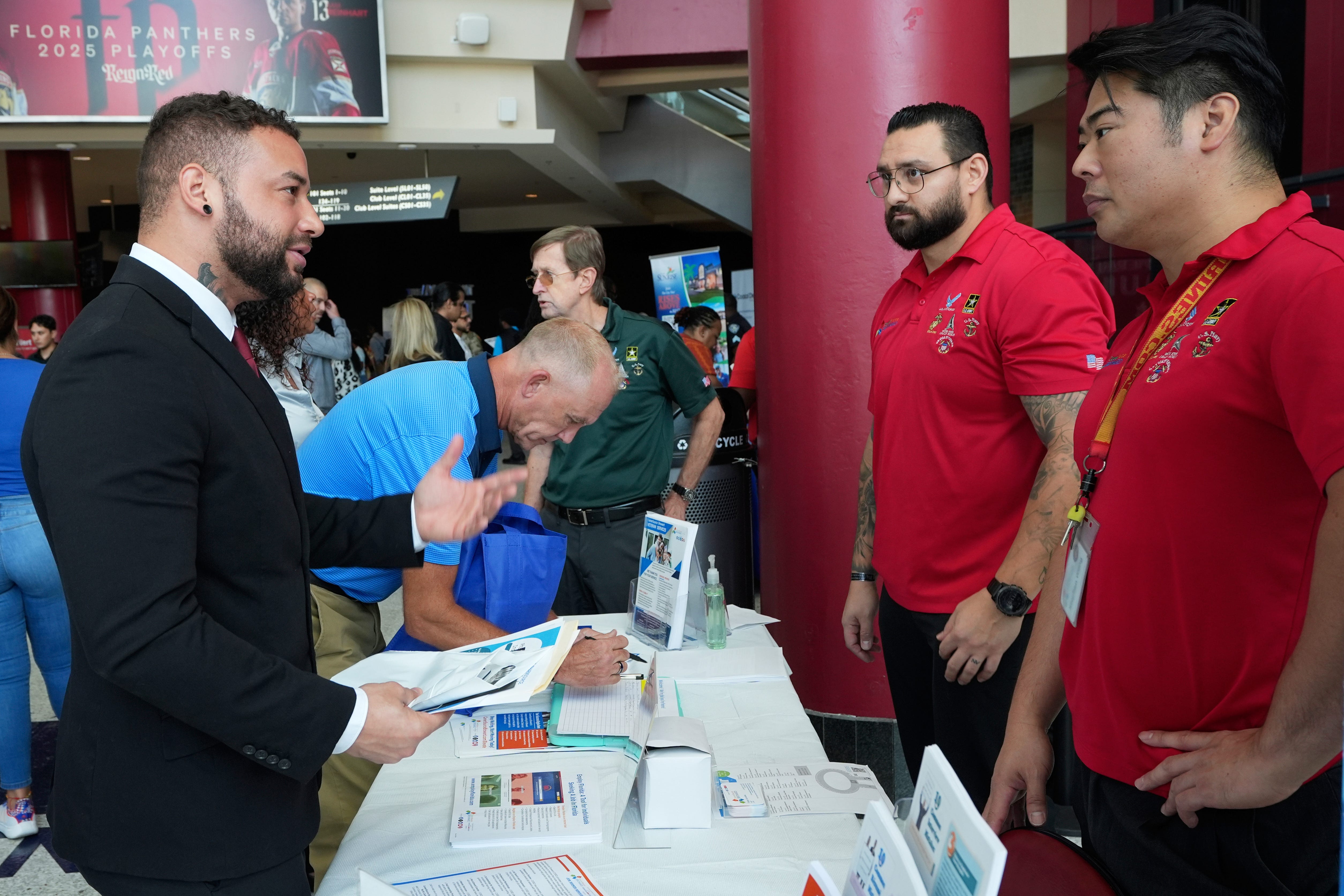 men gather at a job fair