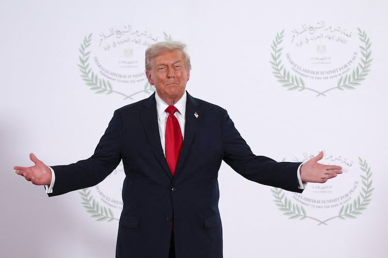 U.S. President Donald Trump poses for a photo during a world leaders' summit