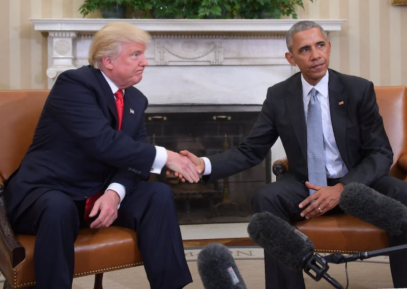 and President-elect Donald Trump shake hands during a  transition planning meeting in the Oval Office at the White House on November 10, 2016 in Washington,DC. (Photo by JIM WATSON / AFP) (Photo by JIM WATSON/AFP via Getty Images)