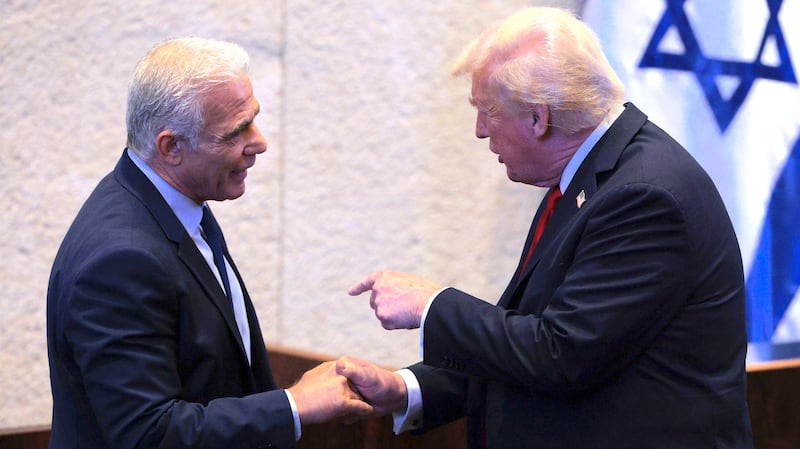 President Donald Trump (R) interacts with Israeli opposition leader Yair Lapid