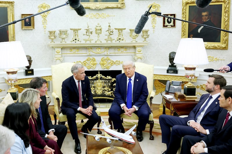 WASHINGTON, DC - OCTOBER 07: U.S. President Donald Trump (R) and Canadian Prime Minister Mark Carney speak to reporters in the Oval Office of the White House on October 07, 2025 in Washington, DC. Carney and Trump will meet in the Oval Office and later have a bilateral lunch where they are expected to discuss a range of topics including U.S. tariffs. Carney visited the White House earlier in the year after he was elected prime minister.  (Photo by Anna Moneymaker/Getty Images)