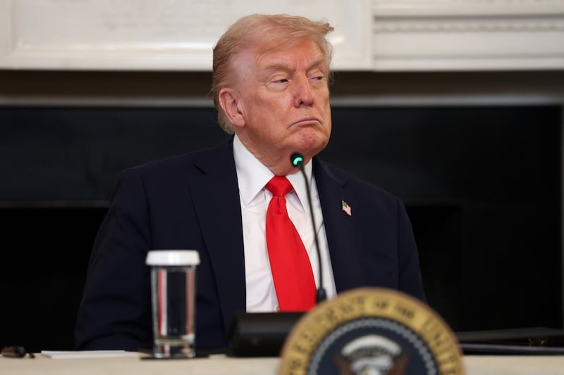 Trump, who signed an executive order designating antifa a "domestic terrorist organization," listens to conservative influencers during a State Dining Room roundtable.