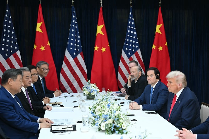 US President Donald Trump (R) and China's President Xi Jinping (L) hold talks at the Gimhae Air Base, located next to the Gimhae International Airport in Busan on October 30, 2025. Donald Trump and Chinese leader Xi Jinping will seek a truce in their bruising trade war on October 30, with the US president predicting a 