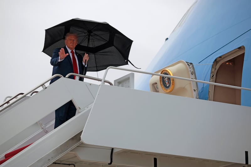 JOINT BASE ANDREWS, MARYLAND - OCTOBER 12: U.S. President Donald Trump waves as he boards Air Force One for a trip to the Middle East on October 12, 2025 at Joint Base Andrews, Maryland. President Trump will address the Israeli Knesset in Jerusalem on Monday, followed by a "Gaza Peace Summit" in Sharm El-Sheikh, Egypt, after helping broker a ceasefire between Israel and Hamas. (Photo by Chip Somodevilla/Getty Images)