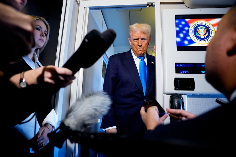 IN AIR, JAPAN - OCTOBER 29: U.S. President Donald Trump speaks to journalists aboard Air Force One en route to South Korea on October 29, 2025 in Japan. Trump is traveling to South Korea for the APEC meetings, following an appearance at the ASEAN summit in Malaysia, and a trip to Japan, where he called on Japanese Emperor Naruhito and new Prime Minister Sanae Takaichi. (Photo by Andrew Harnik/Getty Images)