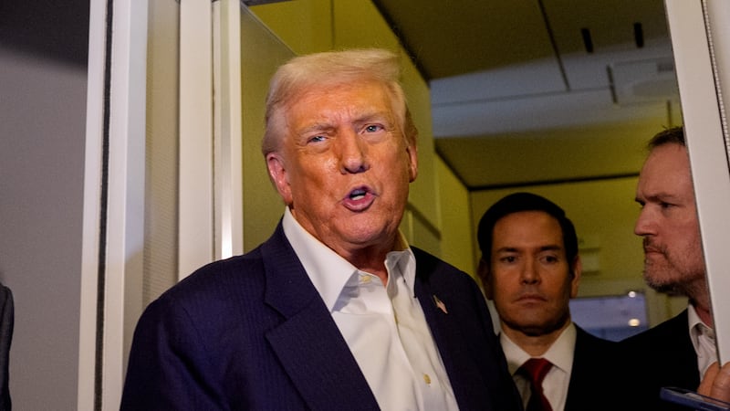Trump talks to reporters on Air Force One