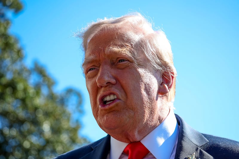 President Donald Trump talks to the media before heading to Marine One on the south lawn of the White House on October 05, 2025 in Washington, DC.