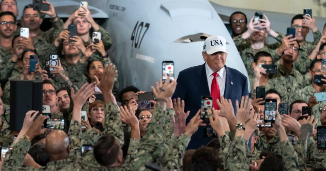 Trump rallies aboard aircraft carrier, tying trade agenda to military goals