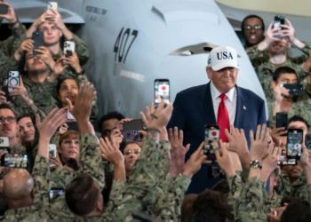 Trump rallies aboard aircraft carrier, tying trade agenda to military goals
