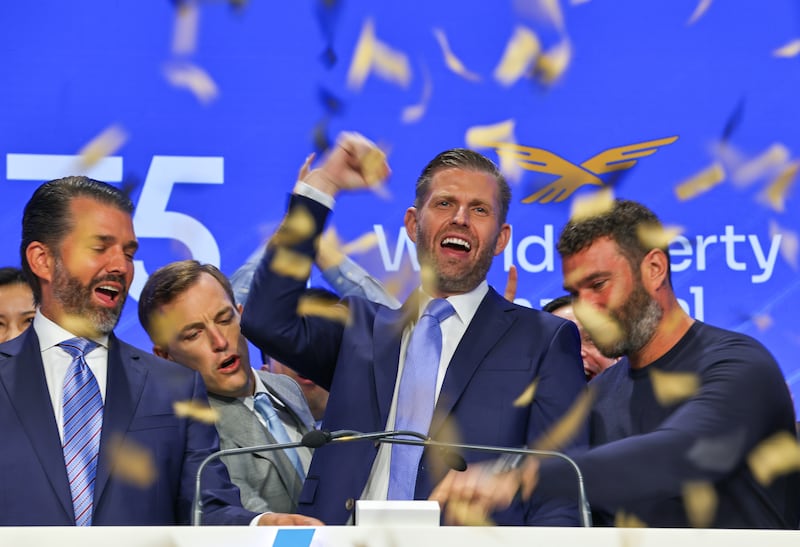 Eric and Donald Trump Jr. celebrate the opening of public trading on their WLFI coin in August, 2025.