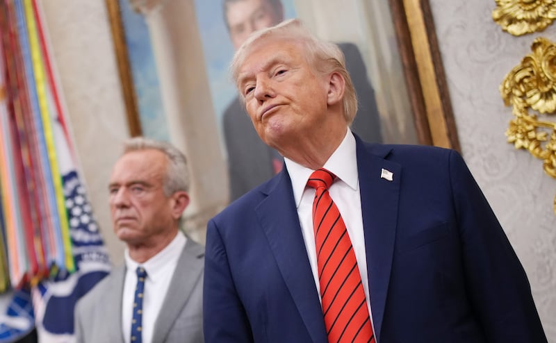 WASHINGTON, DC - OCTOBER 10: U.S. President Donald Trump (R) looks on as Virginia Gov. Glenn Youngkin speaks with Centers for Medicare & Medicaid Services Mehmet Oz (L) and Health and Human Services Secretary Robert F. Kennedy Jr. standing by in the Oval Office of the White House on October 10, 2025 in Washington, DC. Trump is announcing a deal with pharmaceutical company AstraZeneca to lower U.S. prescription drug prices.  (Photo by Andrew Harnik/Getty Images)