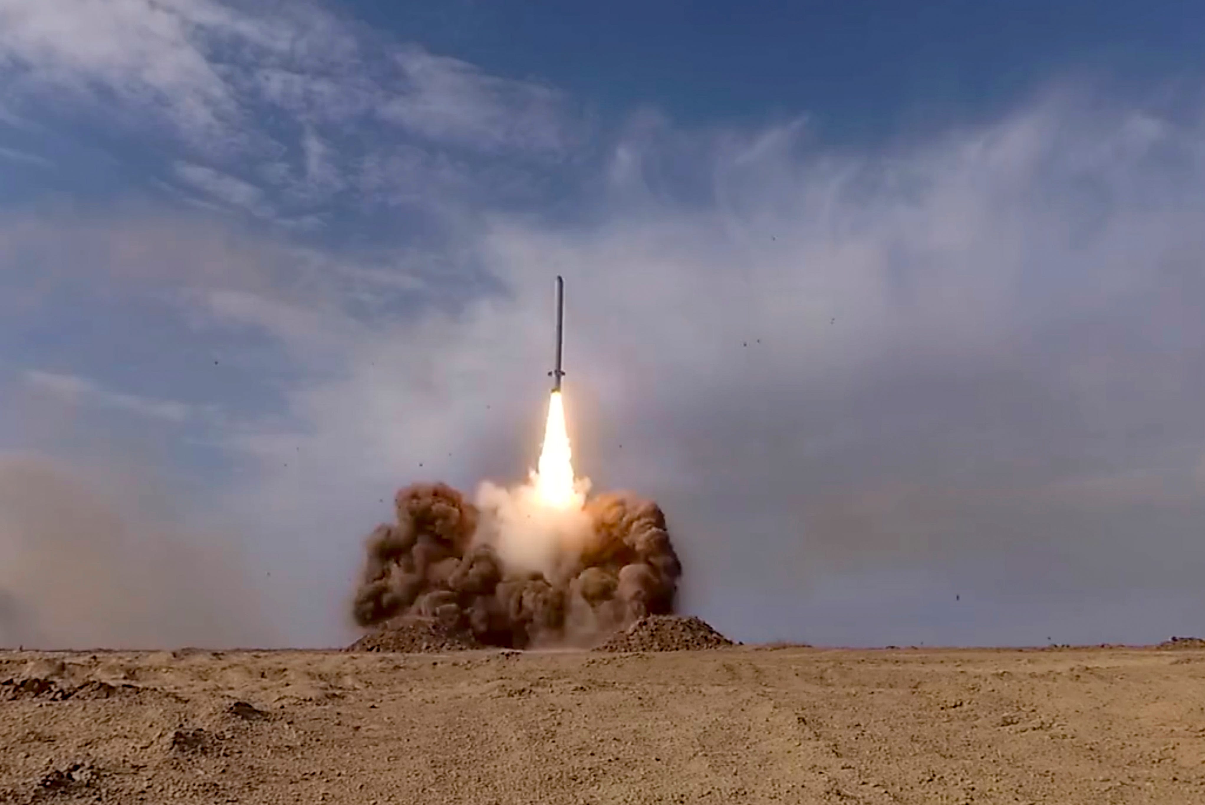In this photo taken from a footage distributed by Russian Defense Ministry Press Service on Sept. 26, 2020, Russian a rocket launches from missile system during the main stage of the Kavkaz-2020 strategic command-and-staff exercises at the Kapustin Yar training ground, Russia.