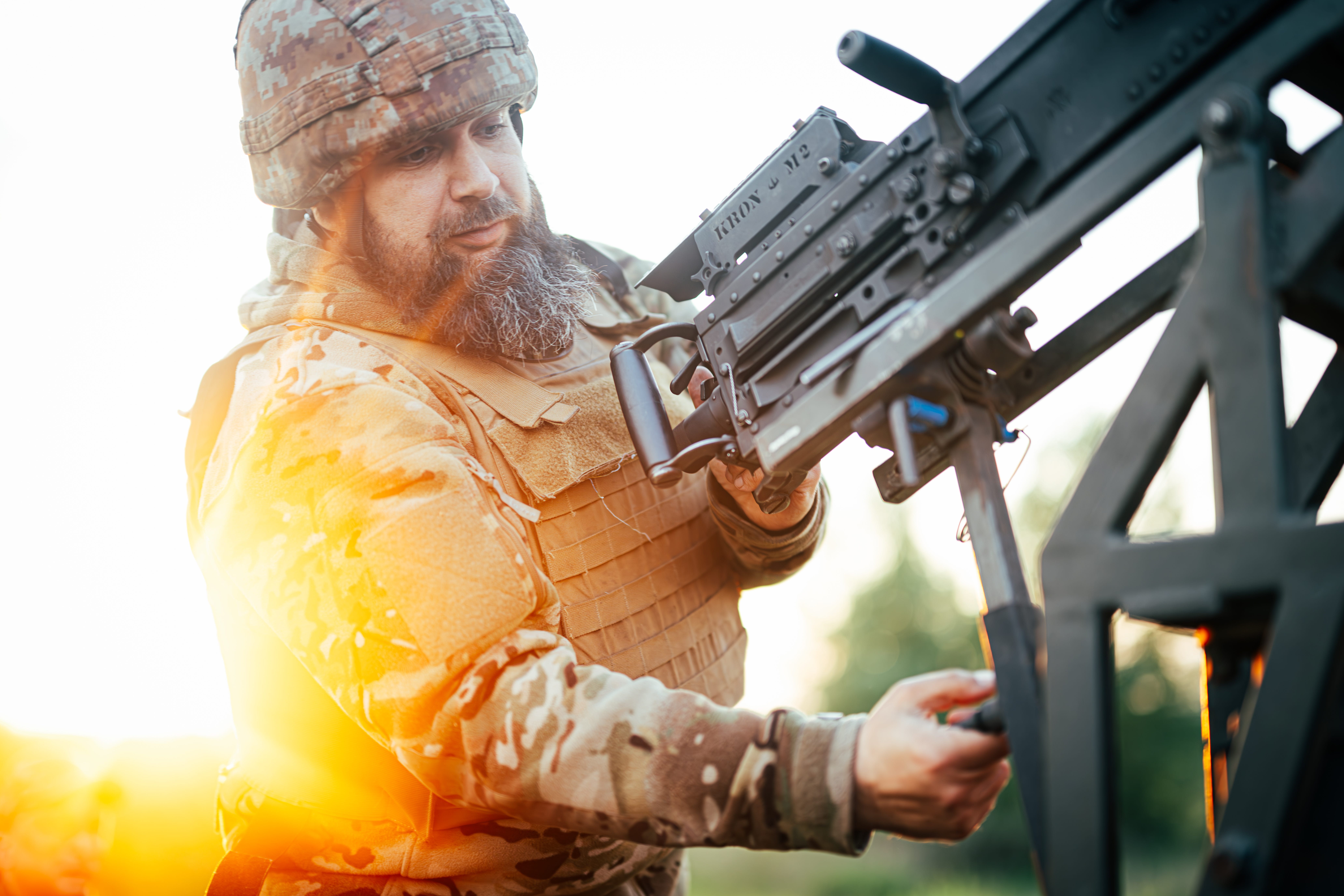 A Ukrainian serviceman prepares an M2 Browning.