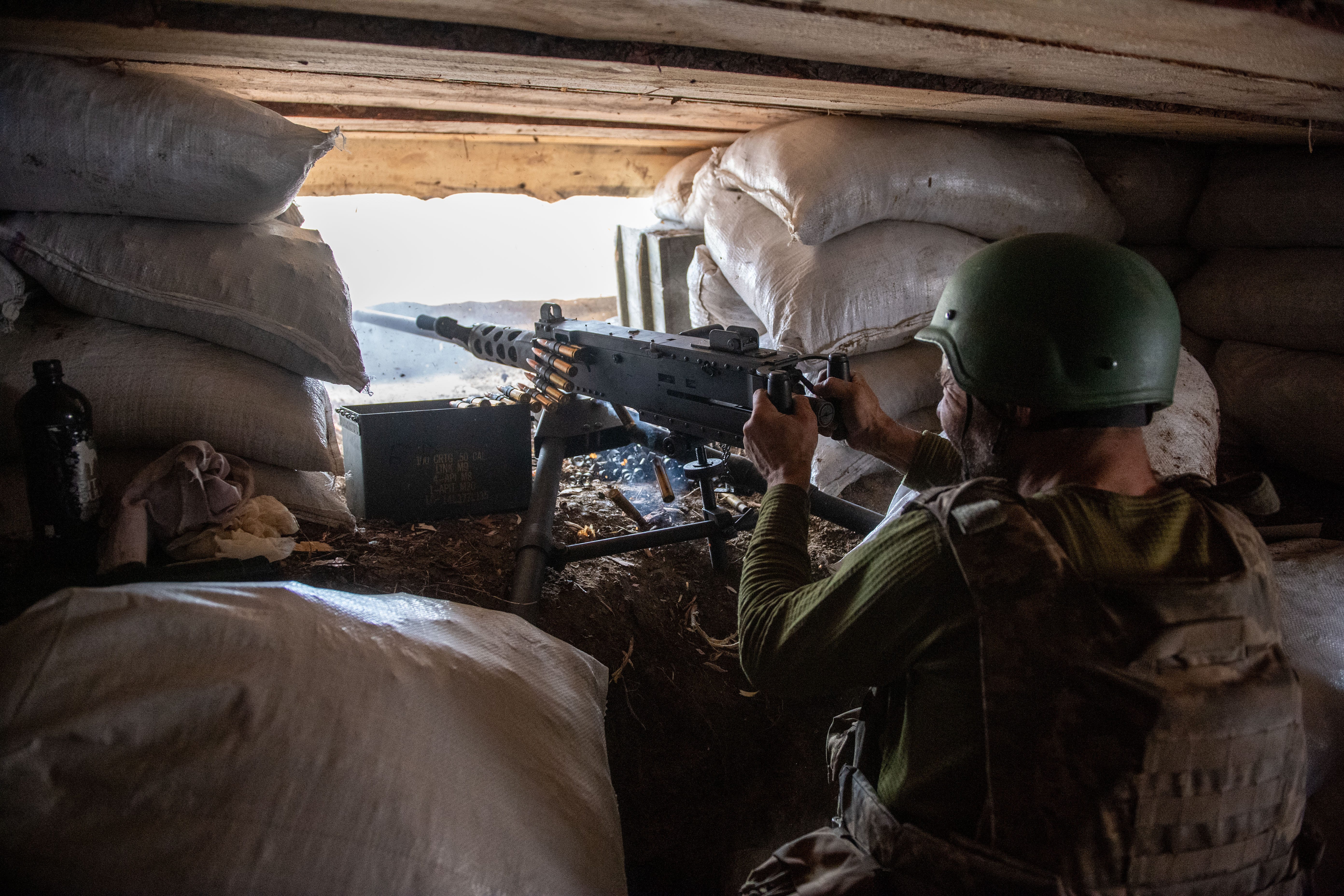 A soldier from the Special Purpose Battalion 'Shkval,' part of Ukraine's 59th Assault Brigade, fires an M2 Browning machine gun during training near Donbas, Ukraine on March 20, 2025.