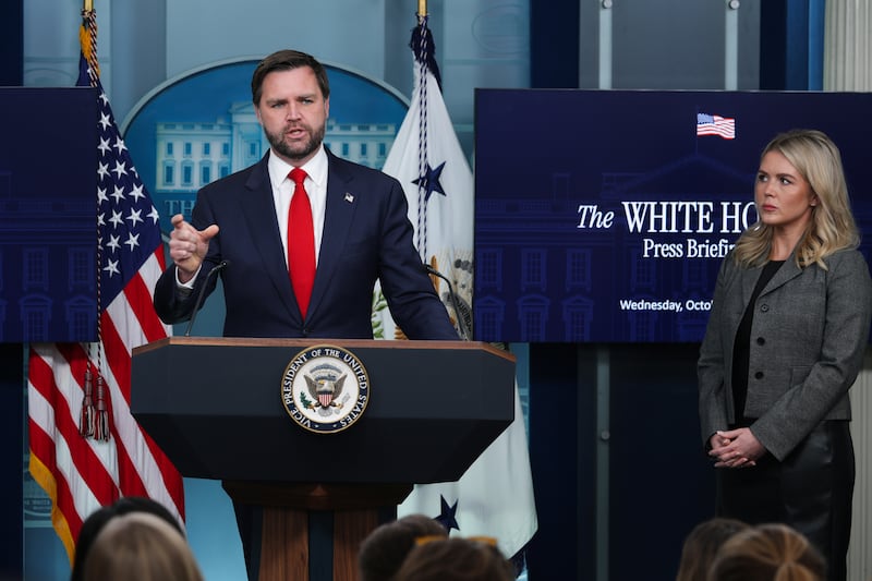 WASHINGTON, DC - OCTOBER 01: U.S. Vice President JD Vance speaks as White House Press Secretary Karoline Leavitt (R) looks on during the daily press briefing in the Brady Press Briefing Room at the White House on October 01, 2025 in Washington, DC. Vance joined Leavitt to discuss the federal government shutdown, after Congress and the White House failed to reach a funding deal by the October 1 deadline and halted U.S. government services for the first time in nearly seven years. (Photo by Alex Wong/Getty Images)