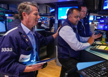 Wall Street rises and pulls close to its record