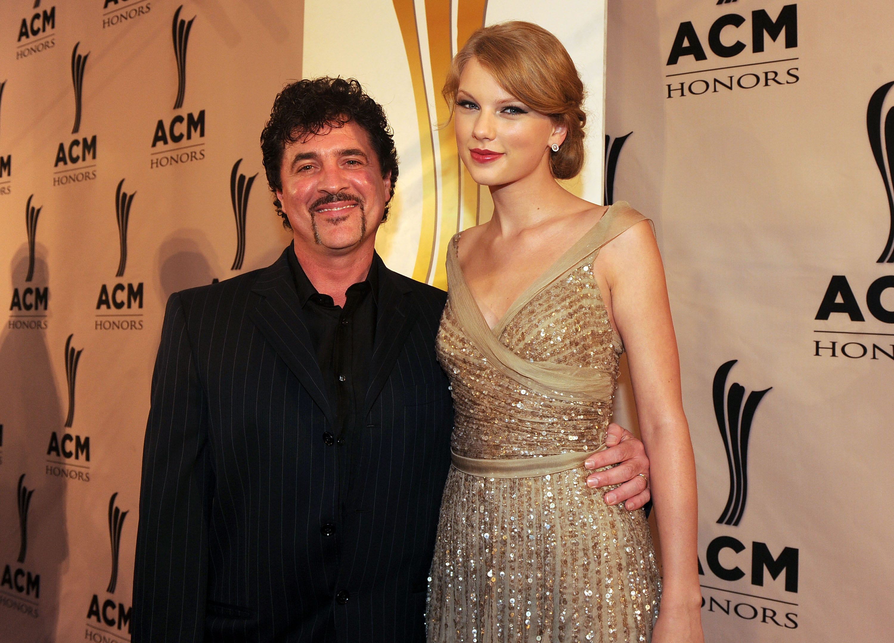 Scott Borchetta and Taylor Swift attend the 2011 ACM Honors.