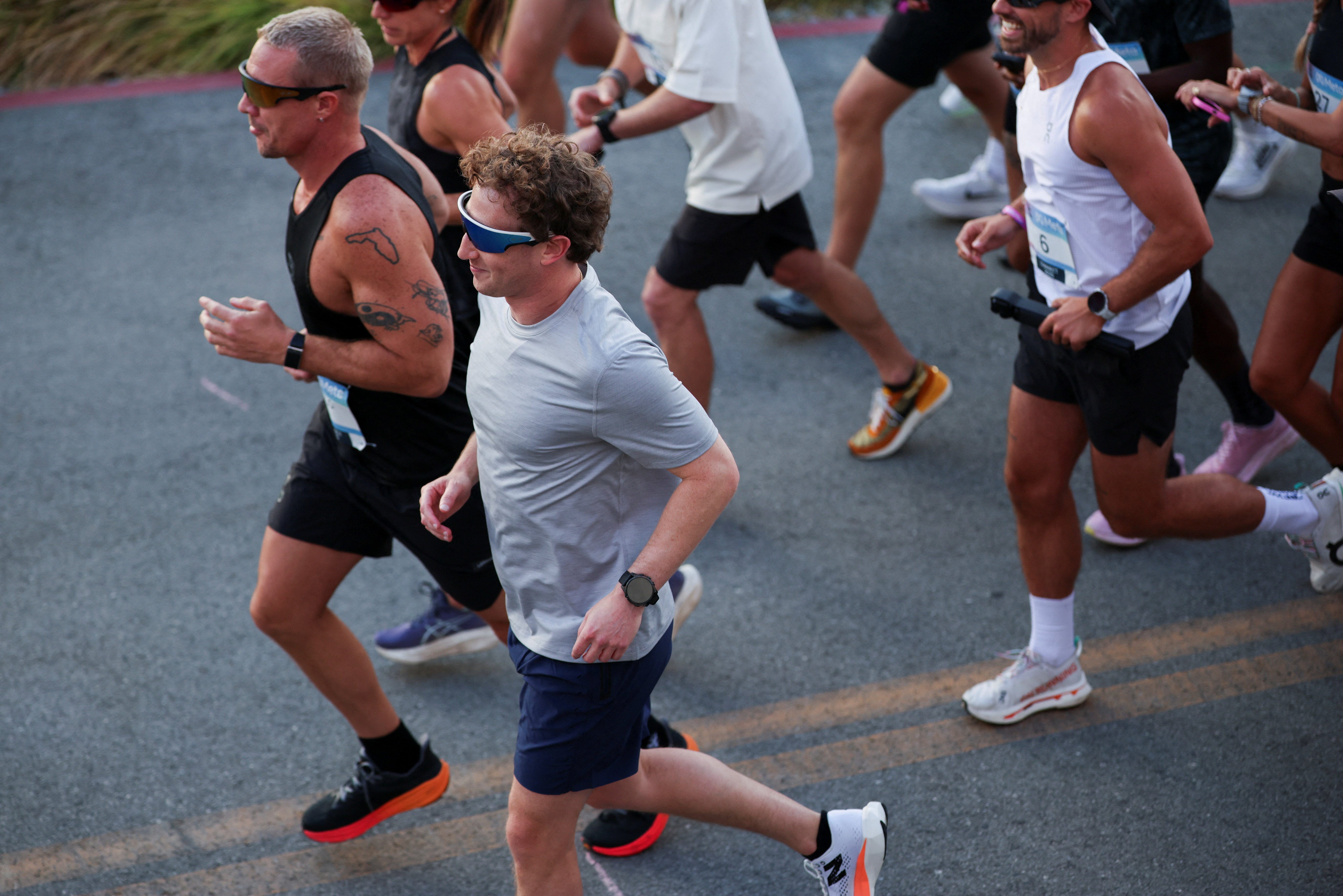 Meta CEO Mark Zuckerberg goes for a run wearing the new Oakley Meta Vanguard glasses after presenting the new line of smart glasses, during the Meta Connect event at the company's headquarters in Menlo Park, California.