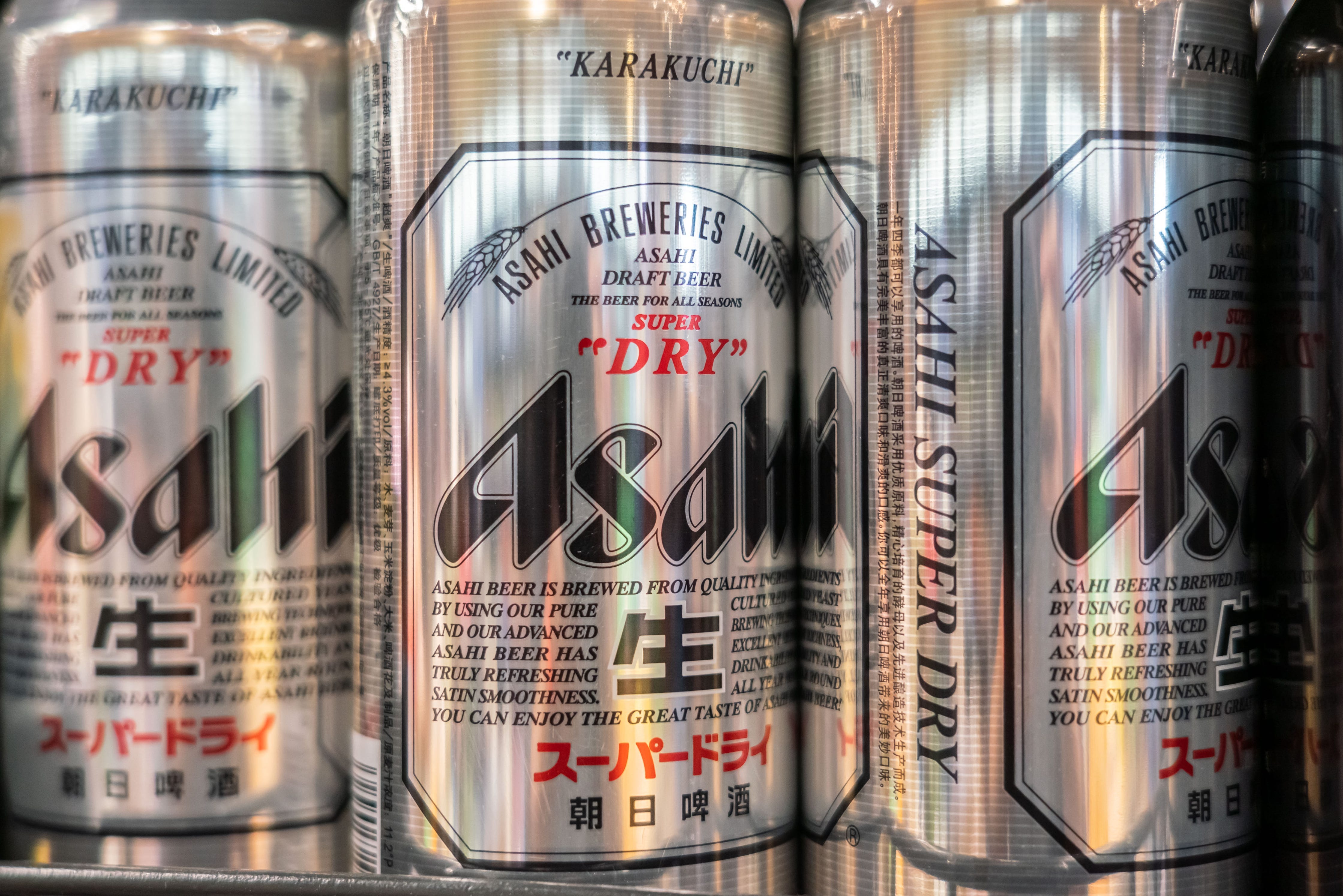 Asahi beers on a shelf.