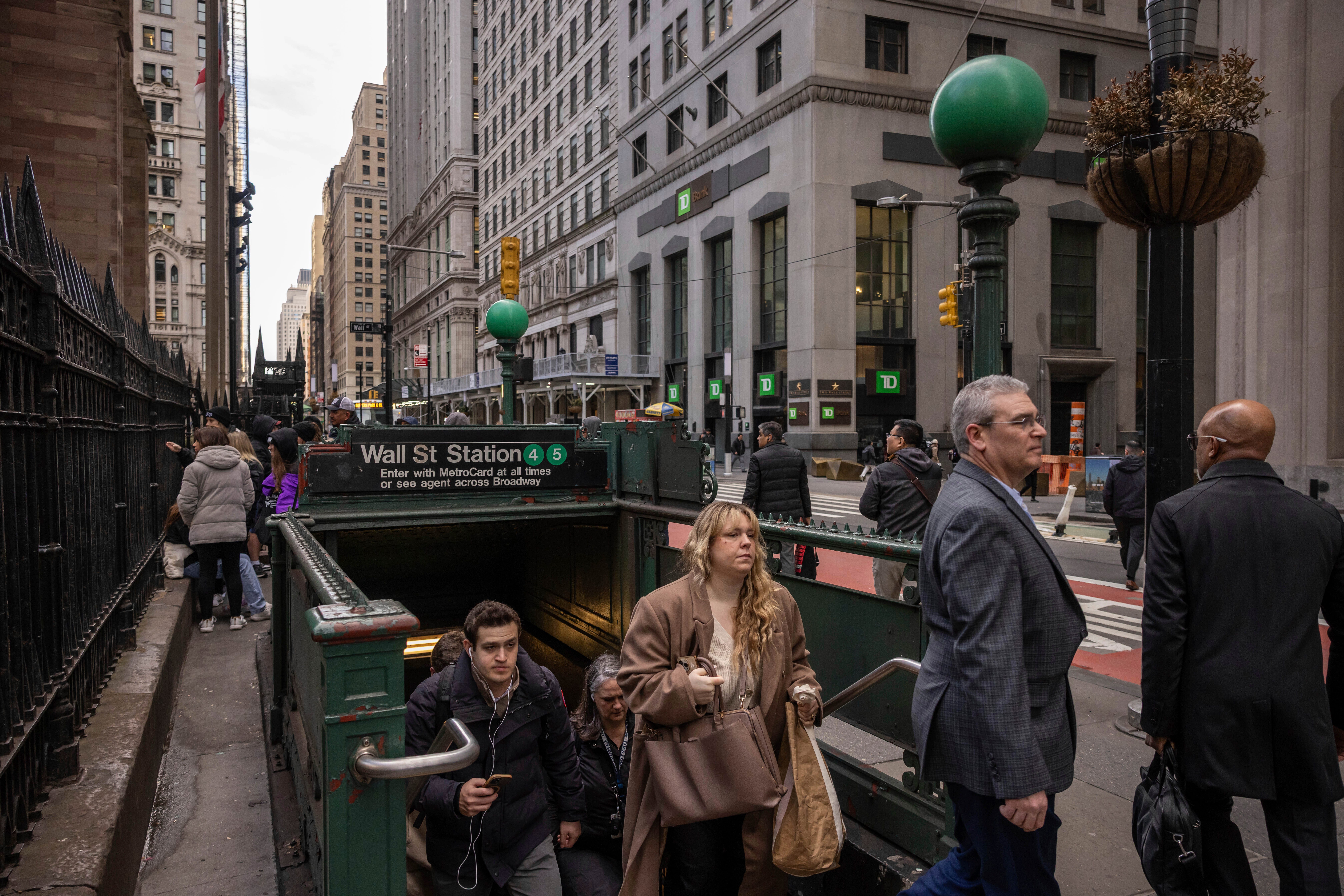 Commuters arrive at Wall Street station