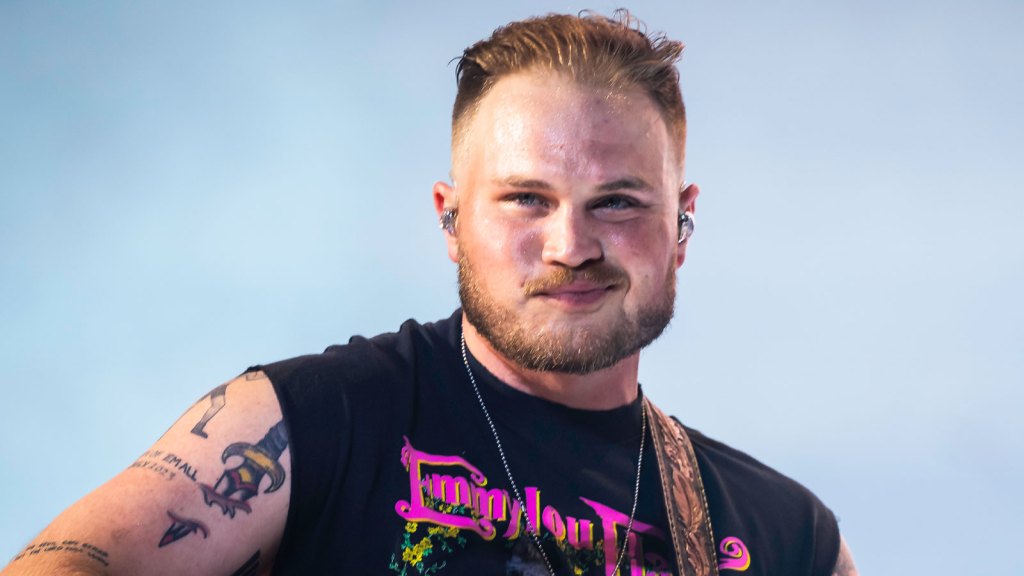 Zach Bryan Reacts To Criticism Over New Song Mentioning ICE, Saying It Will Hit “Both Sides Of The Aisle”: “I’m On Neither Of These Radical Sides”
