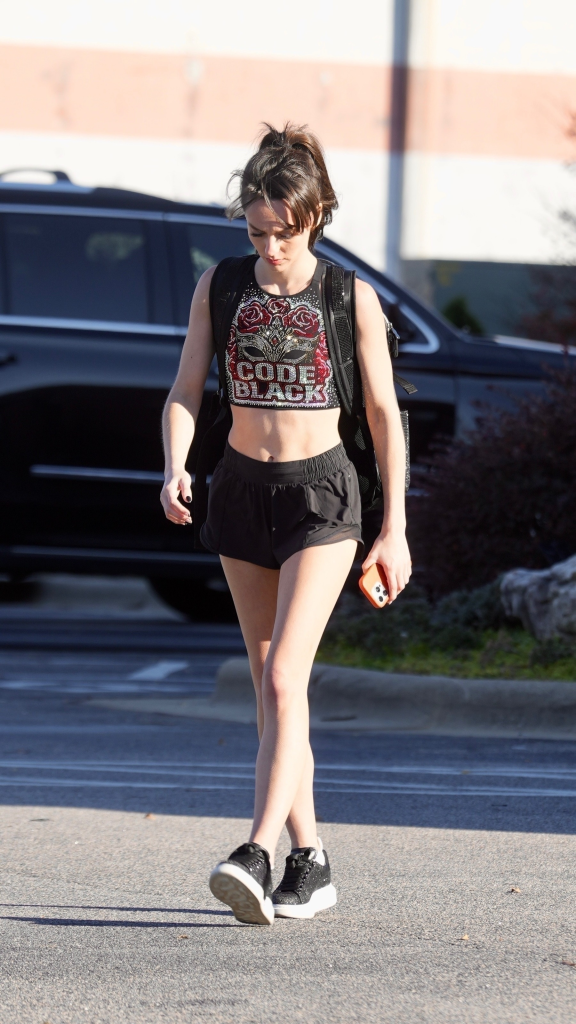 Jordon Hudson walking while wearing a