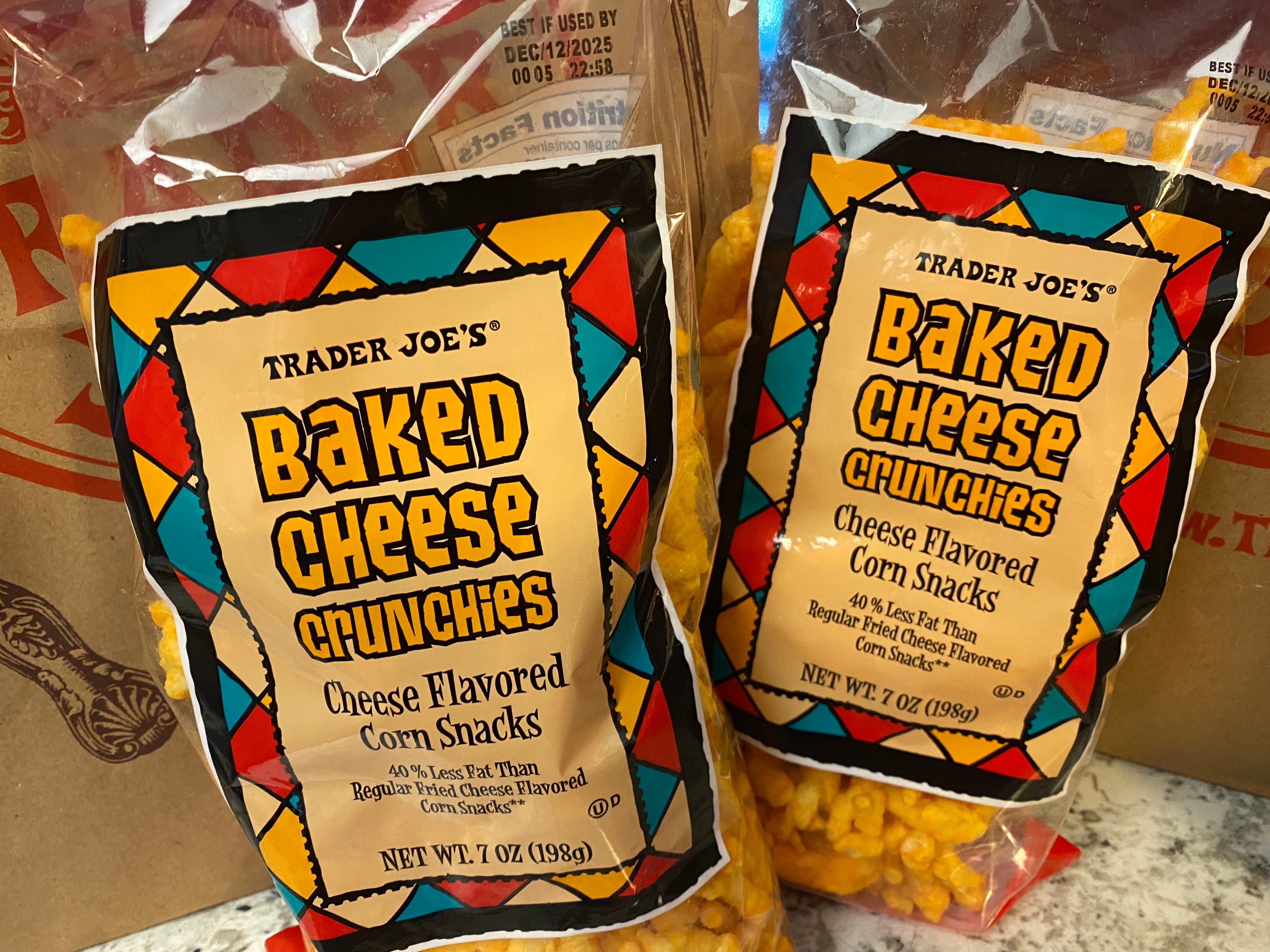 Two bags of Trader Joe's basked cheese crunchies.