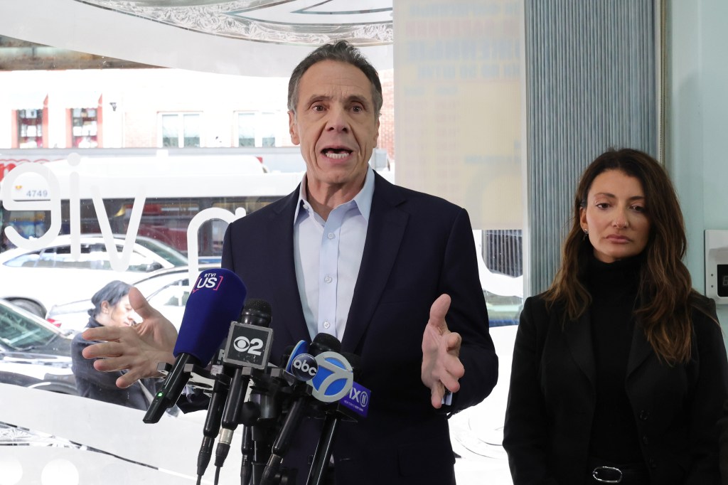 Former New York State Governor Andrew Cuomo speaks at a campaign event in Brighton Beach, standing next to City Council Member Inna Vernikov.
