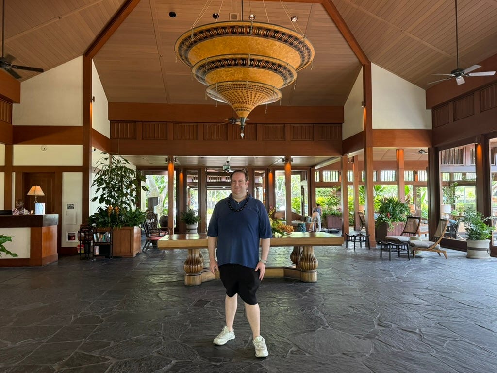Author David Morris standing in lobby of Four Seasons Hualalai