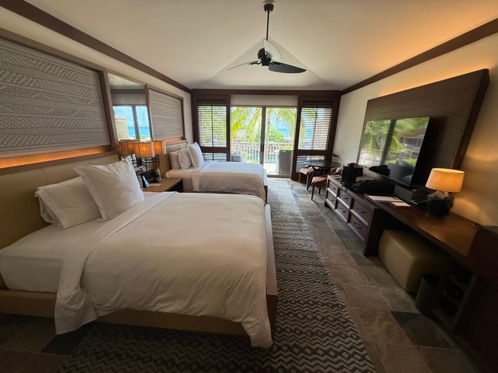 View of hotel room with large floor-to-ceiling windows
